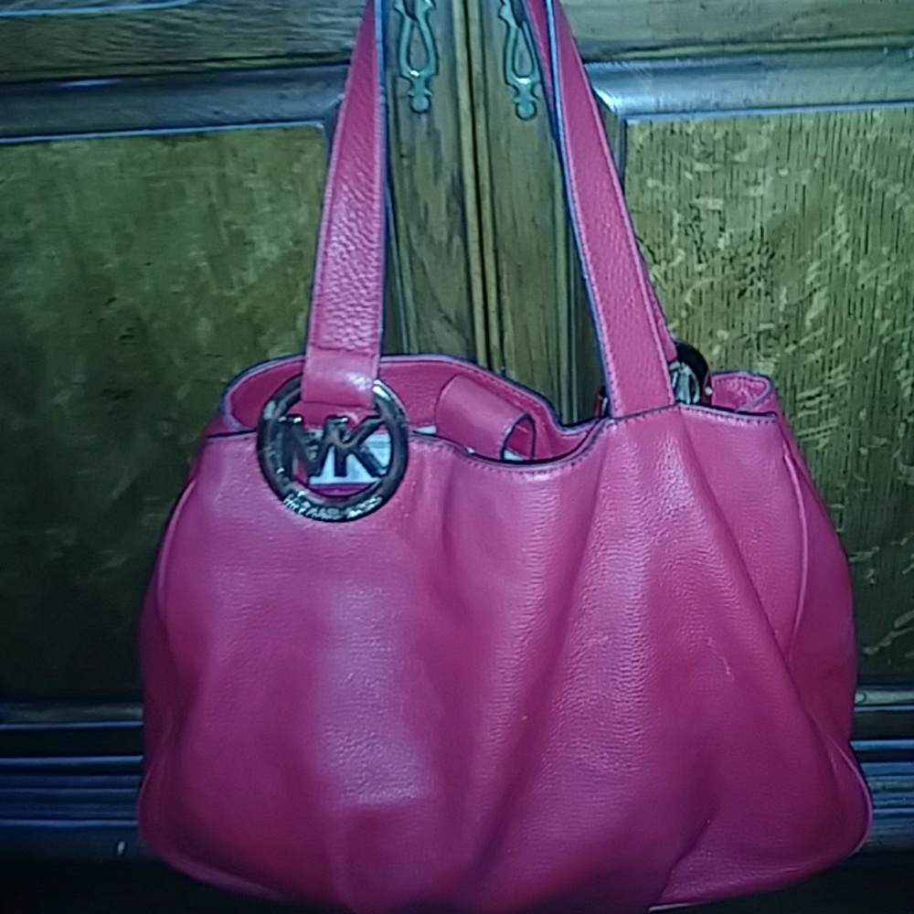 A beautiful red large fluton Michael Kors handbag